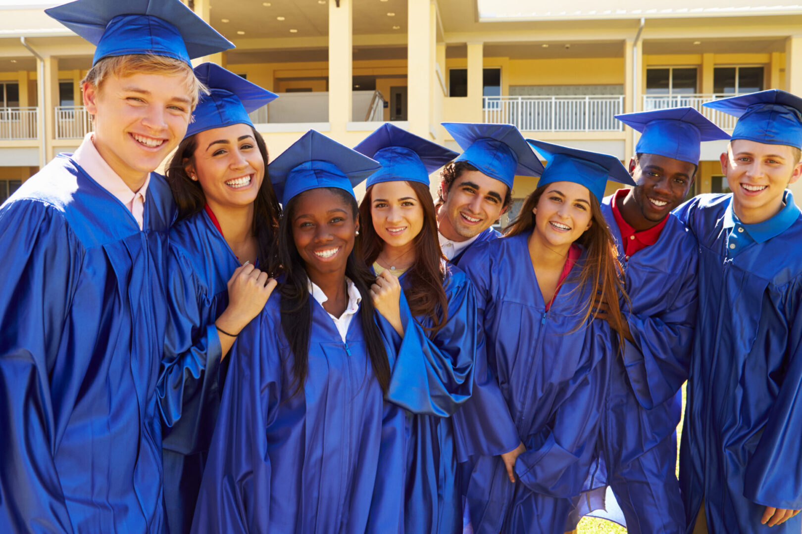 A group of young people in graduation gowns